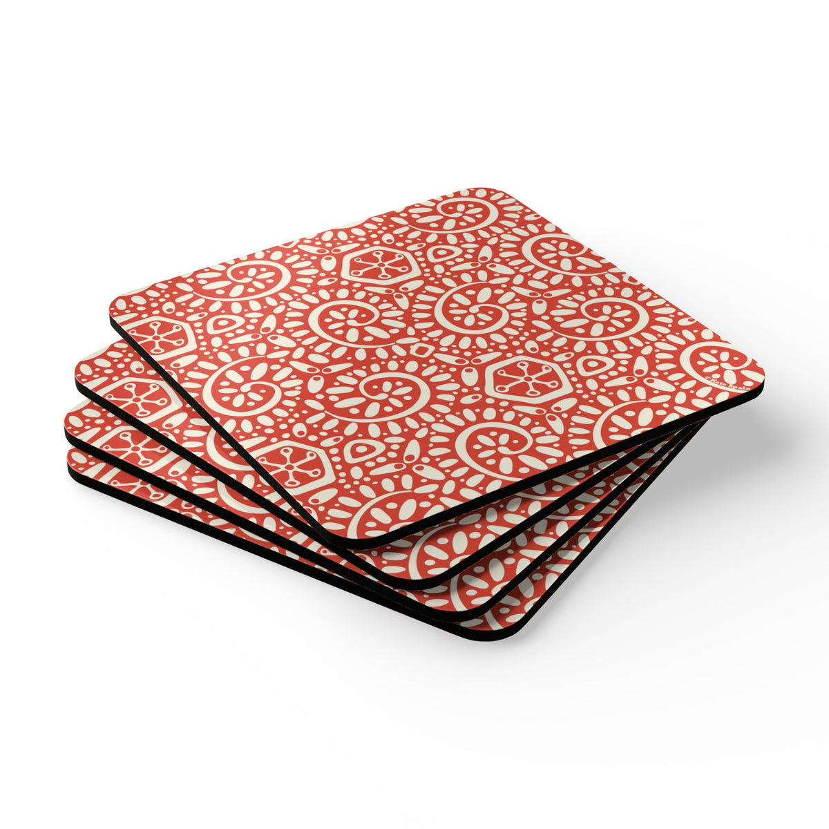 Canto Mandarin cork-backed coaster set of four, cream botanical spirals and petals on tomato red, stacked set, angled view – Kate Spain design
