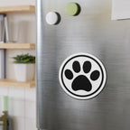 Black-and-white cat paw print die-cut magnet with a circular border, shown on a refrigerator door – Kate Spain design