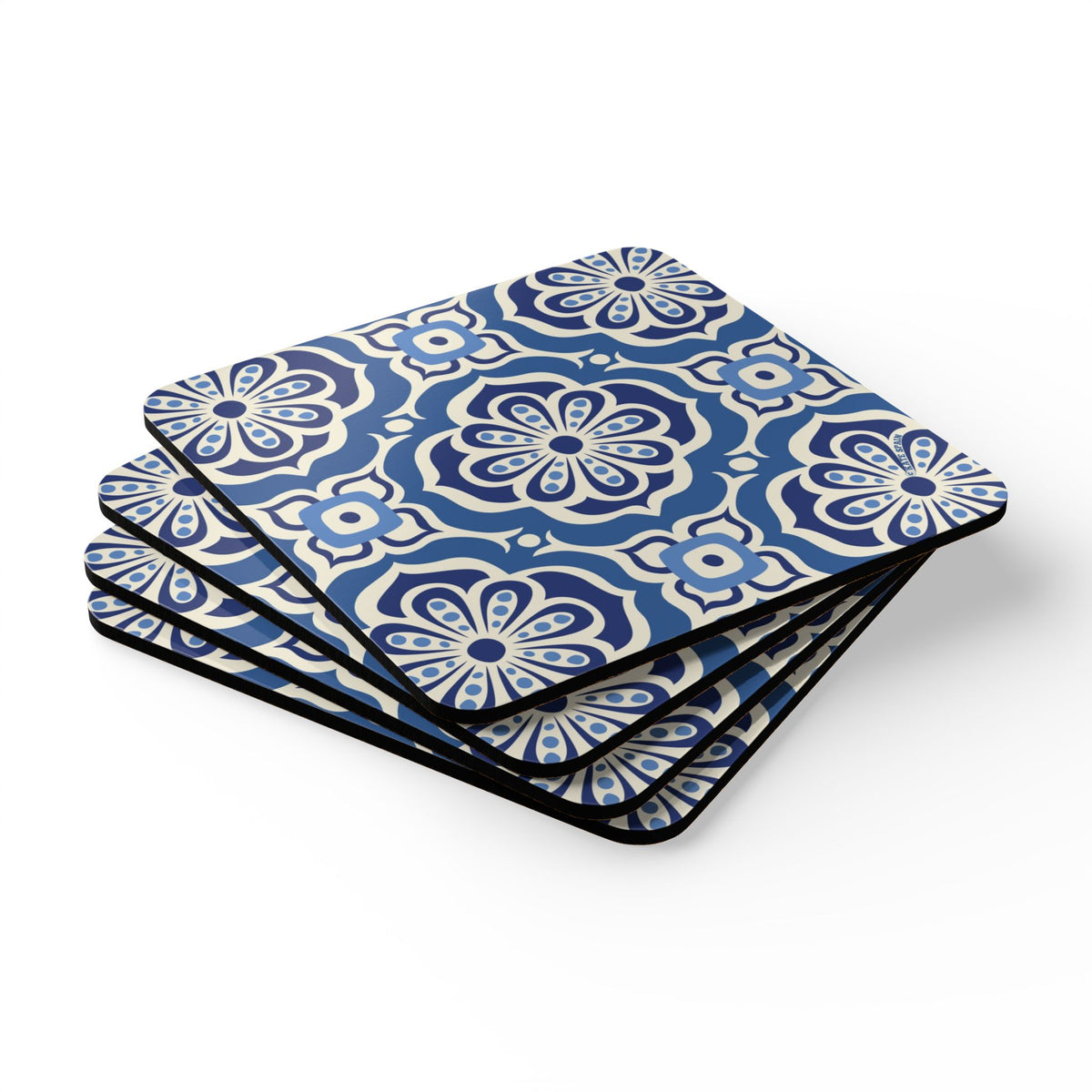 Alhambra Navy cork-backed coaster set of four, Mediterranean tile medallions in navy, cream and cornflower blue, stacked set, angled view – Kate Spain design