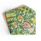 Partridge cork-backed coaster set of four, folk-art partridge among golden pears and patterned leaves on sage green, coasters fanned out – Kate Spain design