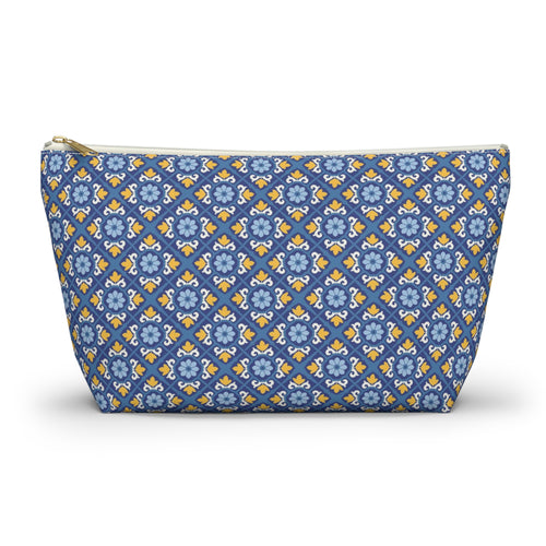 A zippered cosmetic pouch with a blue, yellow, and white geometric pattern, shown on a clean white background.