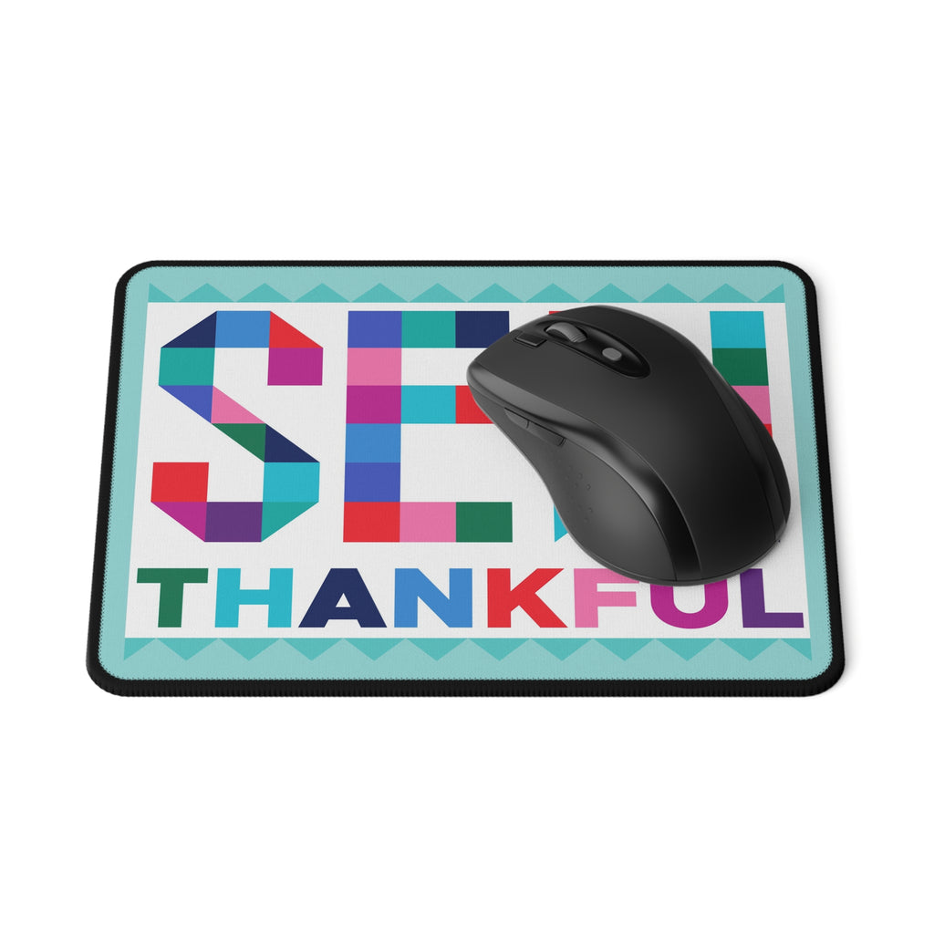 Sew Thankful patchwork lettering mouse pad, with a computer mouse – Kate Spain design for Pat Sloan