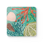 Oceana Shells cork-backed coaster, scallop and cone shells with red coral and seaweed on aqua, single coaster, top view – Kate Spain design