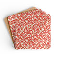 Canto Mandarin cork-backed coaster set of four, cream botanical spirals and petals on tomato red, coasters fanned out – Kate Spain design