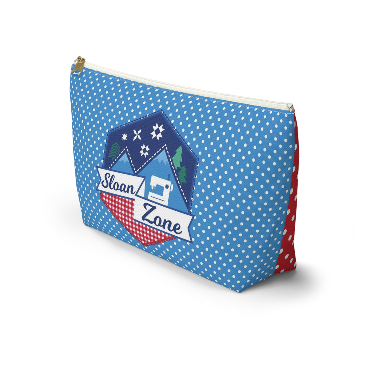 Sloan Zone zip pouch in blue polka dot with the Sloan Zone badge, angled front view – Kate Spain design for Pat Sloan