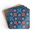 Bolero cork-backed coaster set of four, navy, teal and periwinkle fan medallions with coral daisy centers, coasters fanned out – Kate Spain design