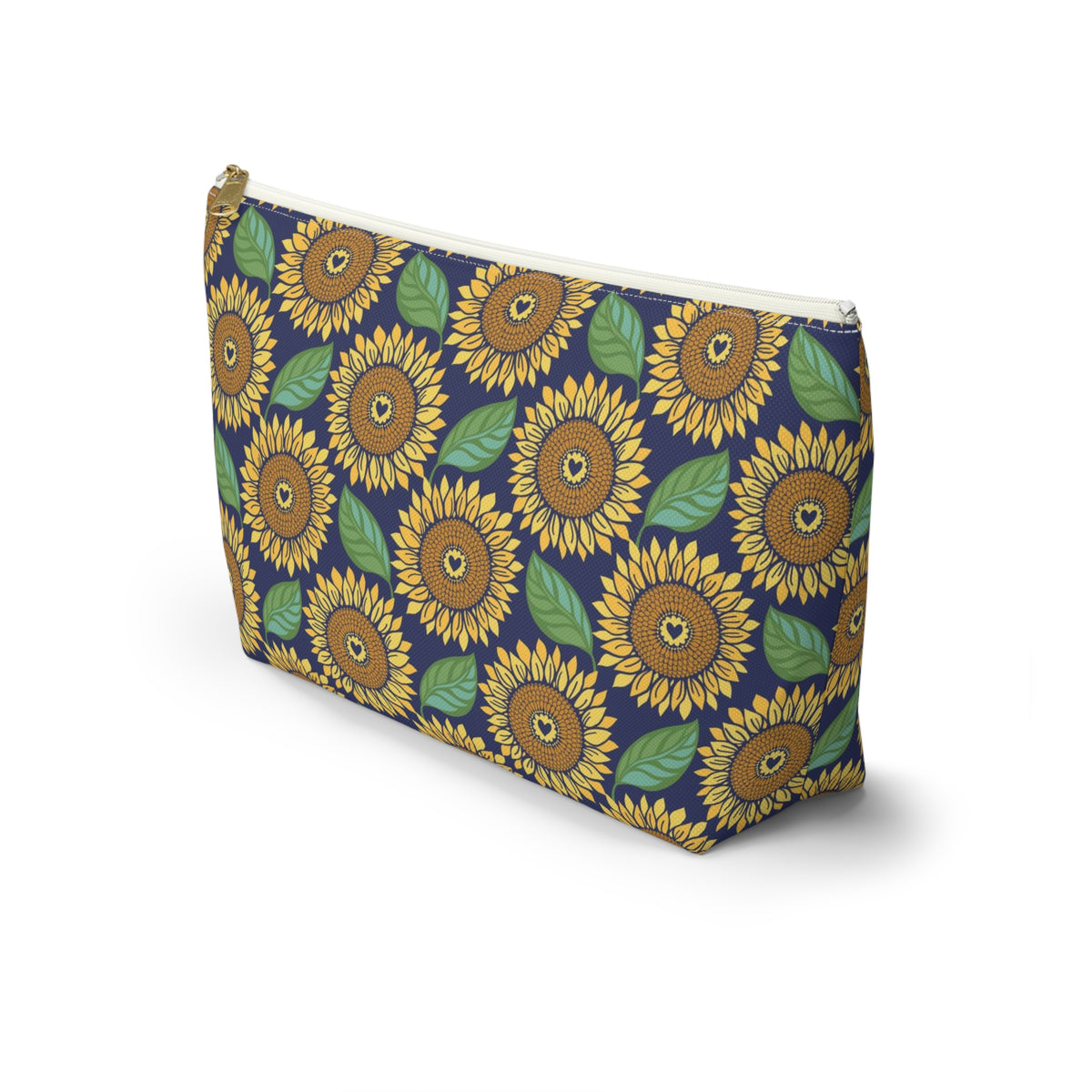 Zip pouch with golden sunflowers and green leaves on navy, white zipper, angled view – Kate Spain design