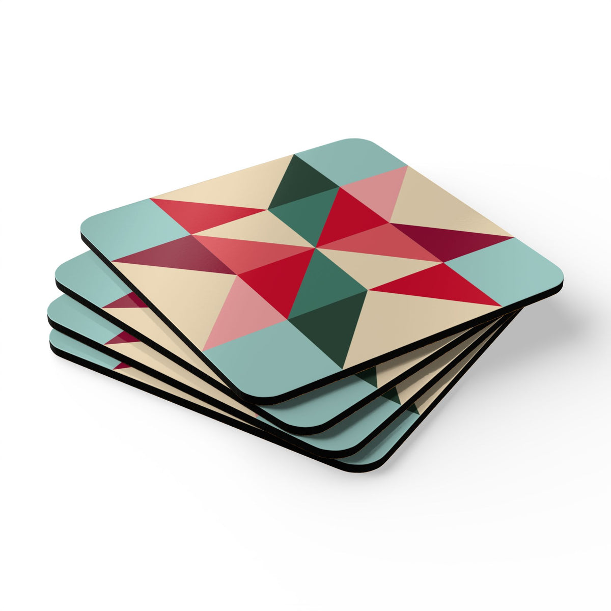 Barn Star cork-backed coaster set of four, quilt-block barn star in red, berry, pink, teal and forest green on cream, stacked set, angled view – Kate Spain design