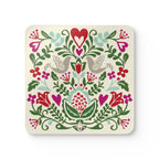 Rosemaling Snow cork-backed coaster, folk-art doves, heart and tulips in red, magenta, green and aqua on cream, single coaster, top view – Kate Spain design