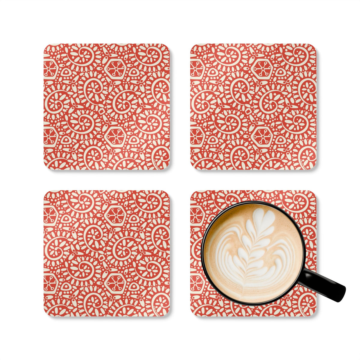 Canto Mandarin cork-backed coaster set of four, cream botanical spirals and petals on tomato red, four coasters with a latte mug – Kate Spain design
