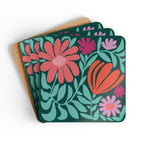 Botanica floral cork-backed coaster set of four with coral, orange, magenta and lavender blooms on deep forest green, coasters fanned out – Kate Spain design