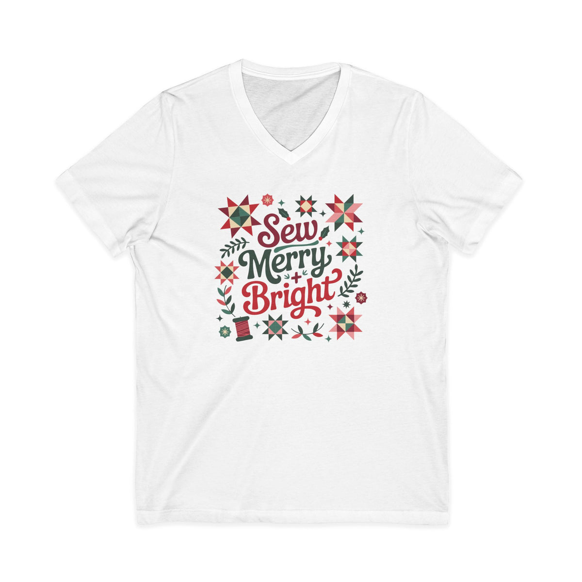 Sew Merry + Bright lettering with quilt-block stars, holly and a thread spool on a V-neck t-shirt in white, front view – Kate Spain design for Pat Sloan