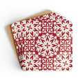 Blizzard cork-backed coaster set of four, red and cream geometric snowflake pattern, coasters fanned out – Kate Spain design