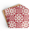 Blizzard cork-backed coaster set of four, red and cream geometric snowflake pattern, coasters fanned out – Kate Spain design