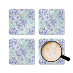 Nantucket Hydrangea cork-backed coaster set of four, periwinkle and lavender hydrangeas with sage leaves on pale aqua, four coasters with a latte mug – Kate Spain design
