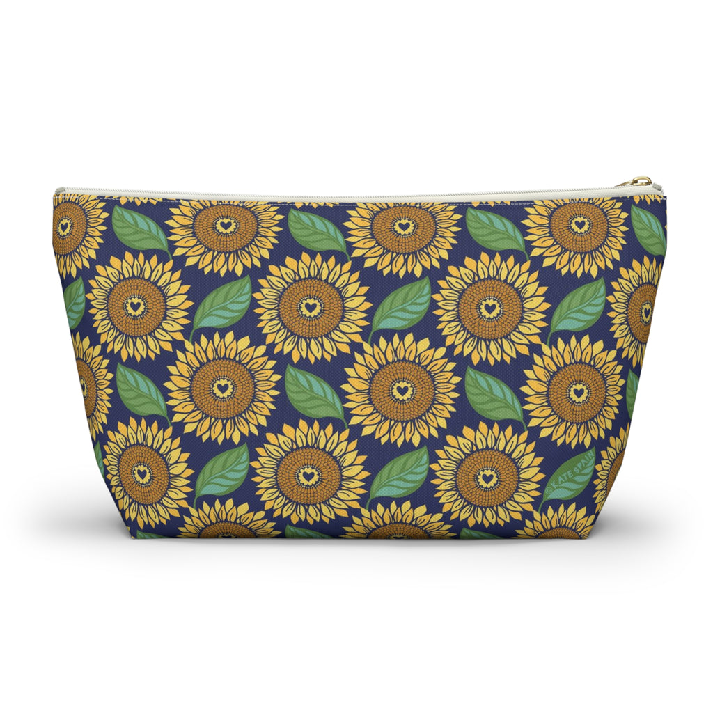 Zip pouch with golden sunflowers and green leaves on navy, white zipper, front view – Kate Spain design