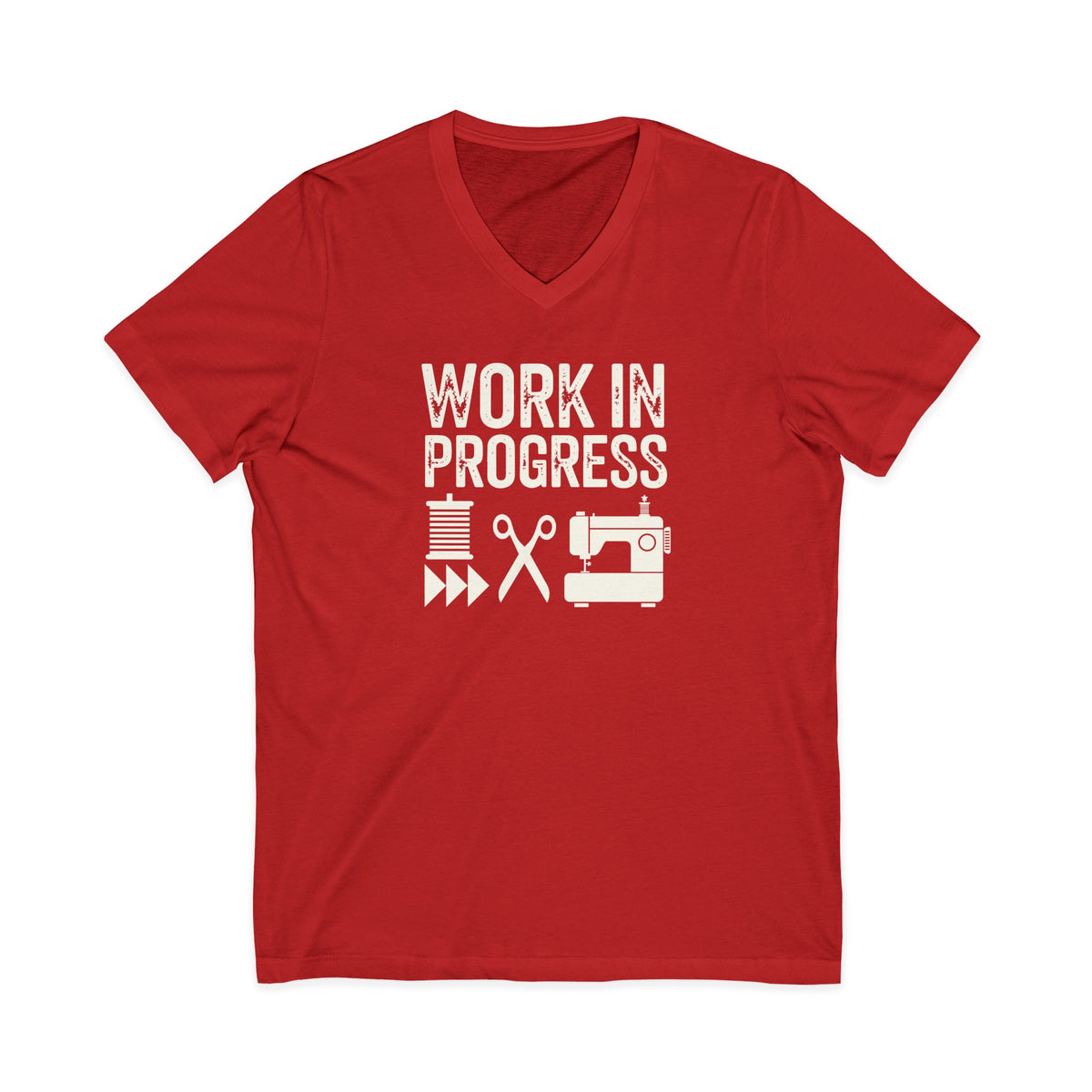 Work in Progress Mod distressed lettering with thread, scissors and sewing machine on a V-neck t-shirt in red, front view – Kate Spain design for Pat Sloan