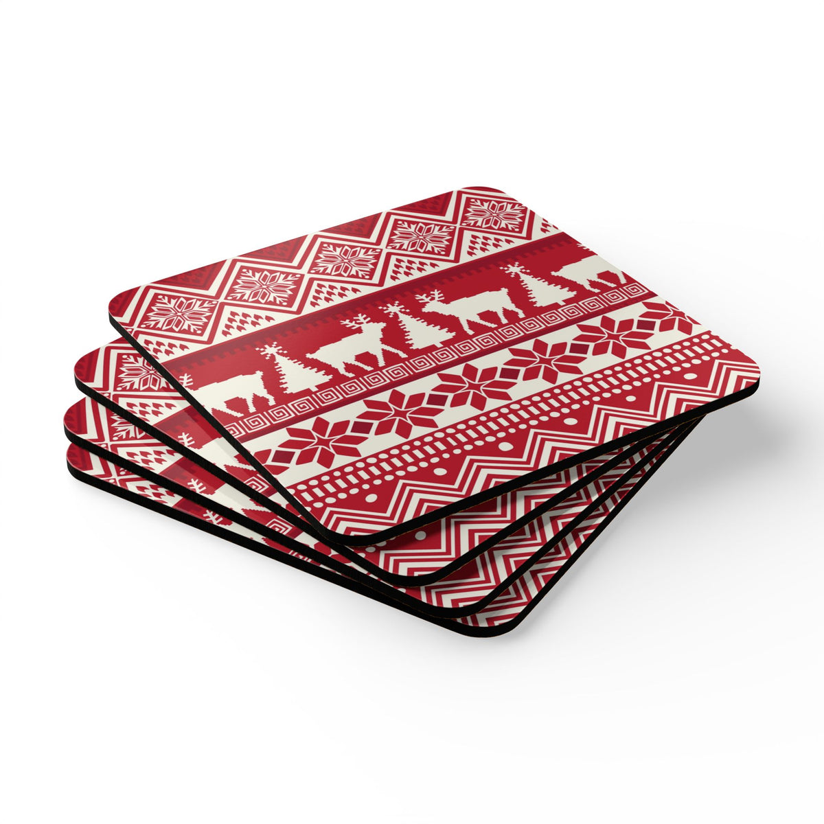 Telemark cork-backed coaster set of four, Nordic reindeer, trees and snowflakes in cream on holiday red, stacked set, angled view – Kate Spain design