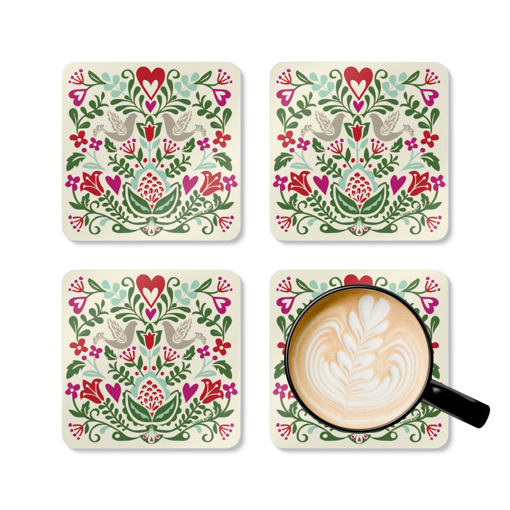 Rosemaling Snow cork-backed coaster set of four, folk-art doves, heart and tulips in red, magenta, green and aqua on cream, four coasters with a latte mug – Kate Spain design