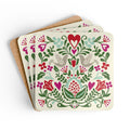 Rosemaling Snow cork-backed coaster set of four, folk-art doves, heart and tulips in red, magenta, green and aqua on cream, coasters fanned out – Kate Spain design