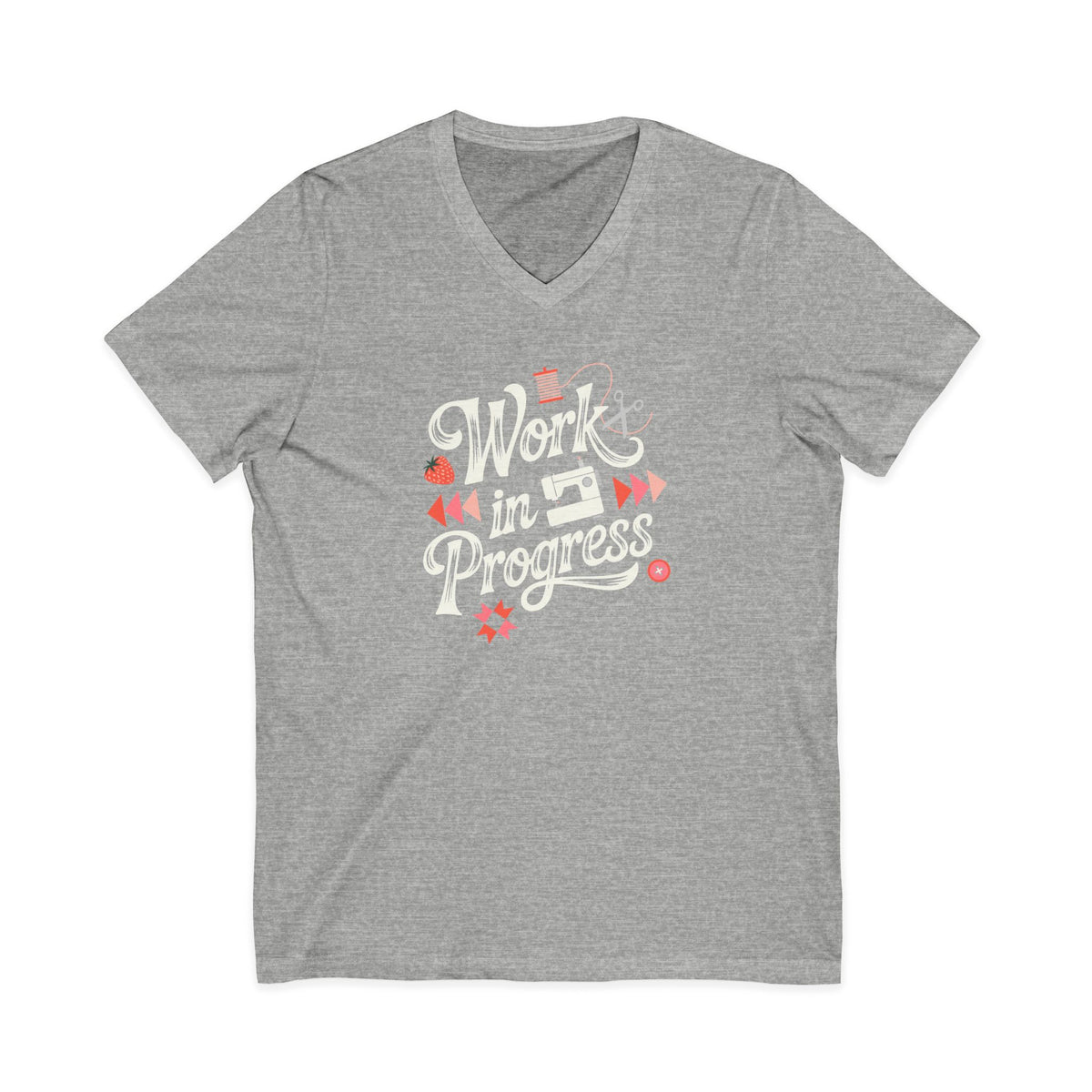 Work in Progress sewing design with flying geese, sewing machine, strawberry and thread spool on a V-neck t-shirt in athletic heather grey, front view – Kate Spain design for Pat Sloan