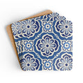 Alhambra Navy cork-backed coaster set of four, Mediterranean tile medallions in navy, cream and cornflower blue, coasters fanned out – Kate Spain design