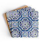 Alhambra Navy cork-backed coaster set of four, Mediterranean tile medallions in navy, cream and cornflower blue, coasters fanned out – Kate Spain design