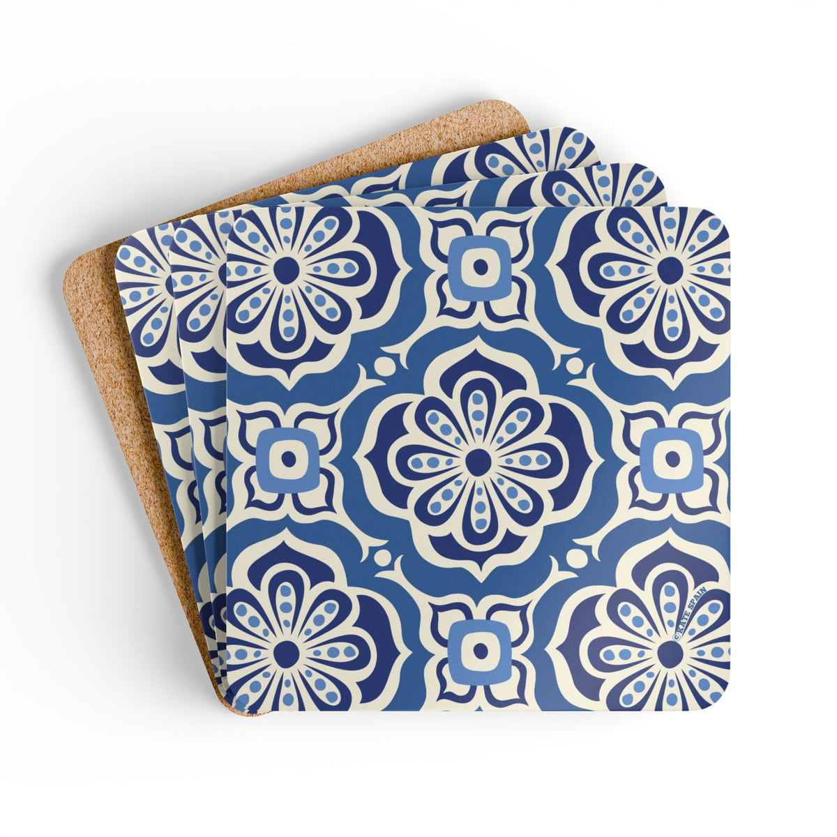 Alhambra Navy cork-backed coaster set of four, Mediterranean tile medallions in navy, cream and cornflower blue, coasters fanned out – Kate Spain design