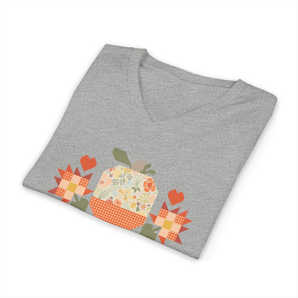 Falling for Fall patchwork pumpkin with quilt-block stars and hearts on a V-neck t-shirt in athletic heather grey, folded close-up of the design – Kate Spain design for Pat Sloan
