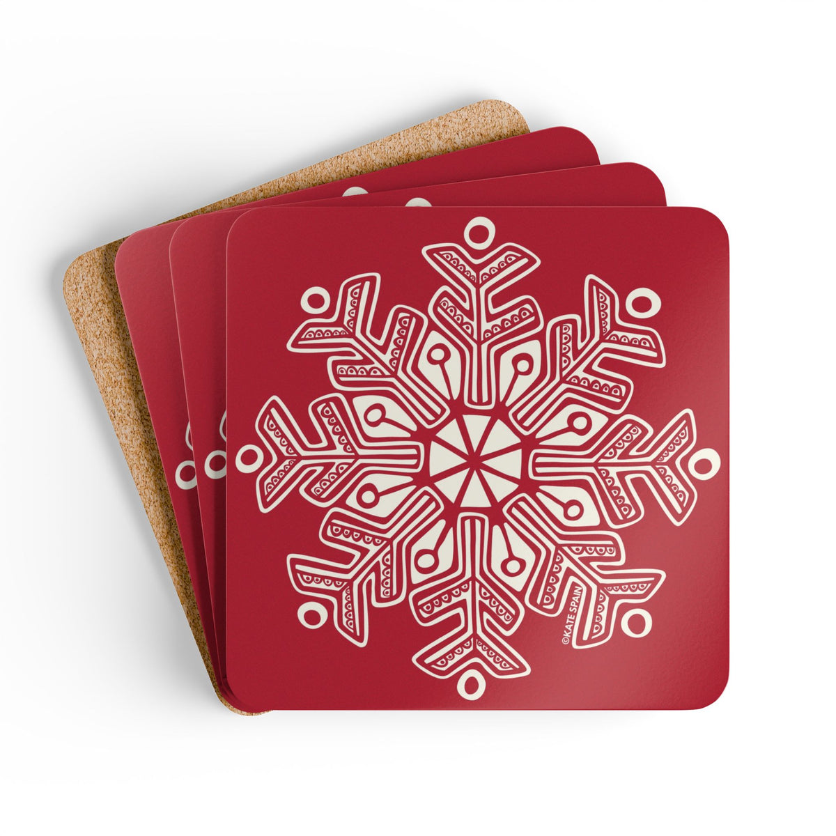 Scandinavian Snow cork-backed coaster set of four, oversized cream snowflake on holiday red, coasters fanned out – Kate Spain design