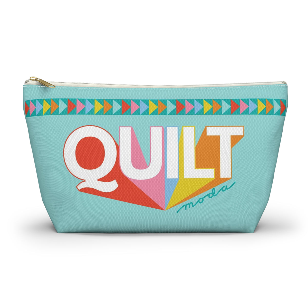 A light blue zippered pouch featuring a colorful geometric 'QUILT' design with the brand name 'moda' in script, set against a plain white background.