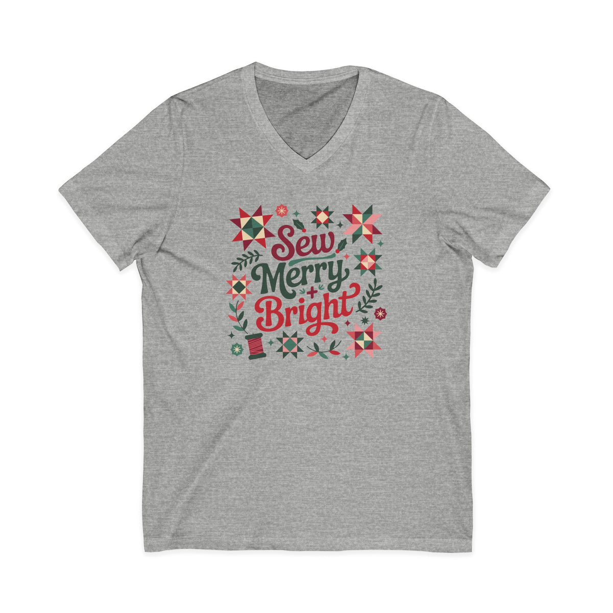 Sew Merry + Bright lettering with quilt-block stars, holly and a thread spool on a V-neck t-shirt in athletic heather grey, front view – Kate Spain design for Pat Sloan