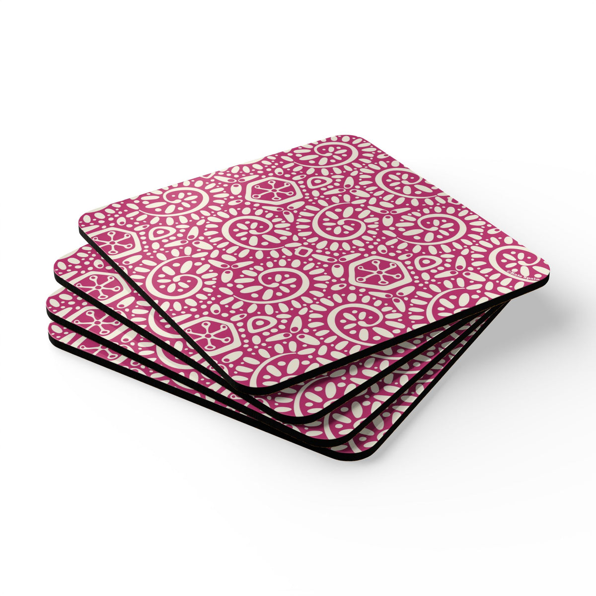 Canto Berry cork-backed coaster set of four, cream botanical spirals and petals on berry fuchsia, stacked set, angled view – Kate Spain design