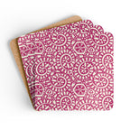 Canto Berry cork-backed coaster set of four, cream botanical spirals and petals on berry fuchsia, coasters fanned out – Kate Spain design
