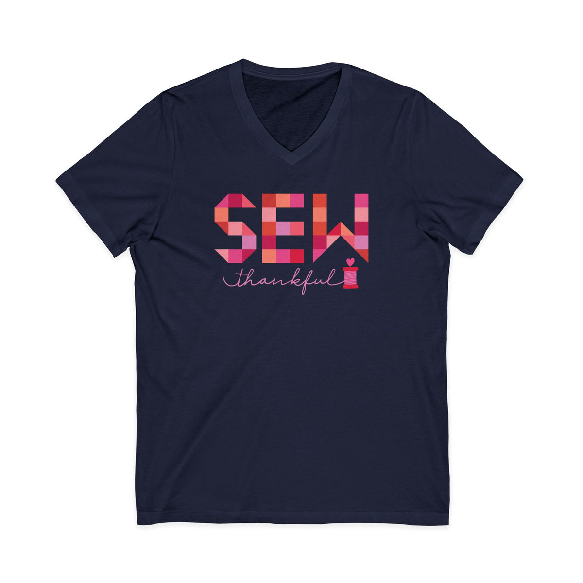 Sew Thankful patchwork lettering with a heart-topped thread spool on a V-neck t-shirt in navy, front view – Kate Spain design for Pat Sloan