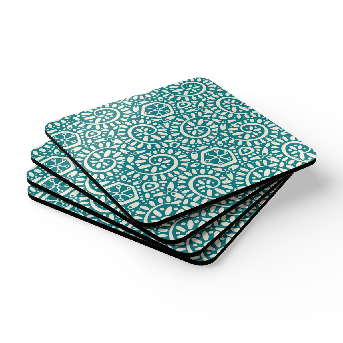 Canto Turquoise cork-backed coaster set of four, cream botanical spirals and petals on turquoise, stacked set, angled view – Kate Spain design