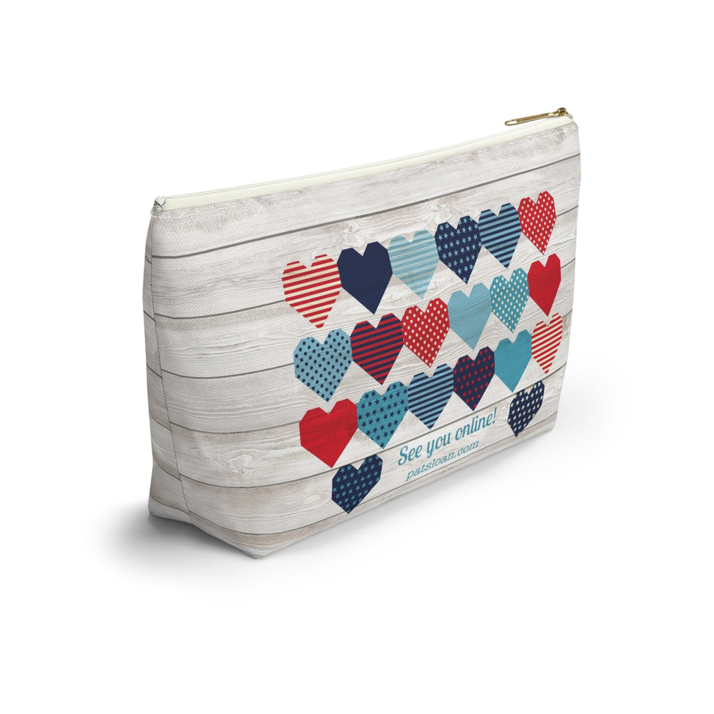 Liberty Love zip pouch with star quilt blocks on the front and hearts on the back, angled back view – Kate Spain design for Pat Sloan