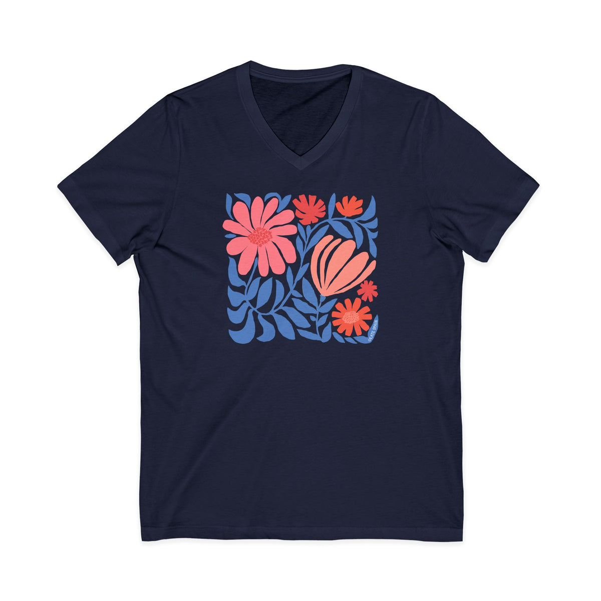 Botanica modern floral design with pink and coral blooms on a V-neck t-shirt in navy, front view – Kate Spain design