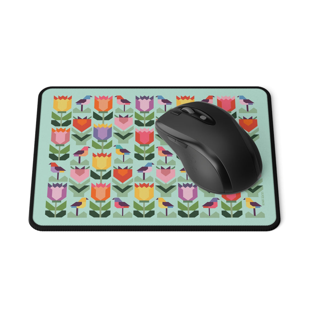 Birds + Blooms patchwork tulips and birds mouse pad, with a computer mouse – Kate Spain design for Pat Sloan