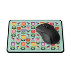 Birds + Blooms patchwork tulips and birds mouse pad, with a computer mouse – Kate Spain design for Pat Sloan