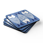 Catch of the Day cork-backed coaster set of four, white and navy stylized fish on periwinkle blue, stacked set, angled view – Kate Spain design