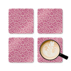 Canto Berry cork-backed coaster set of four, cream botanical spirals and petals on berry fuchsia, four coasters with a latte mug – Kate Spain design