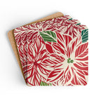 Poinsettia cork-backed coaster set of four, oversized red and cream poinsettia with forest green leaves, coasters fanned out – Kate Spain design
