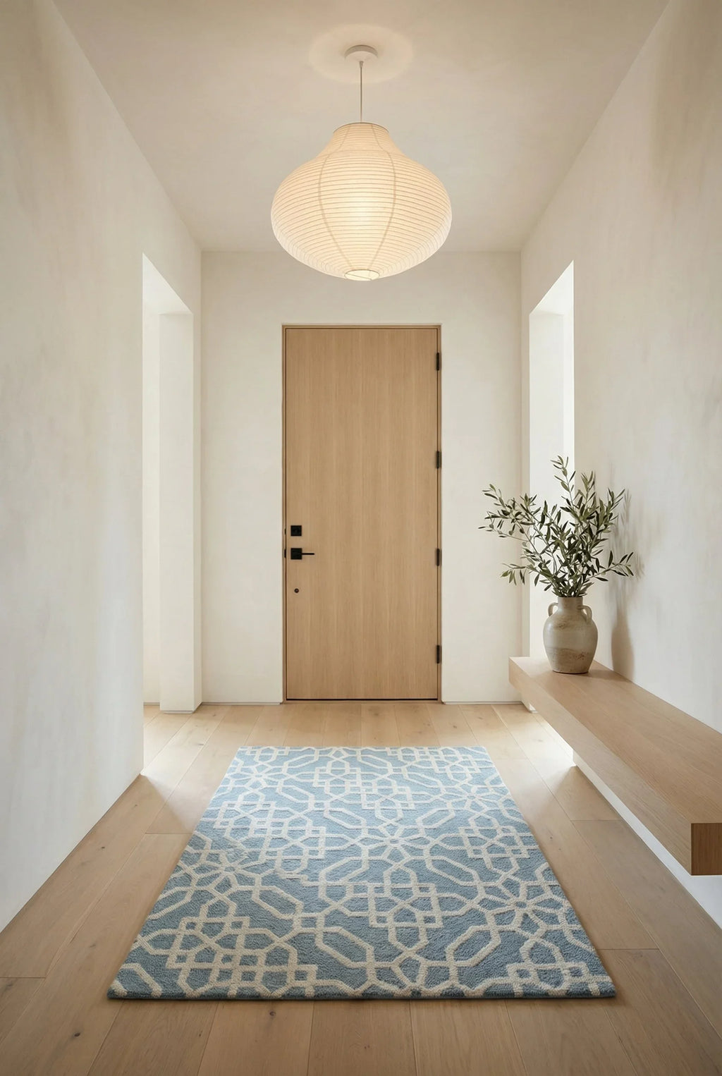 eye heart hand Atrium hand-tufted wool rug with a blue-grey and cream geometric lattice, in a bright entry foyer – Kate Spain design