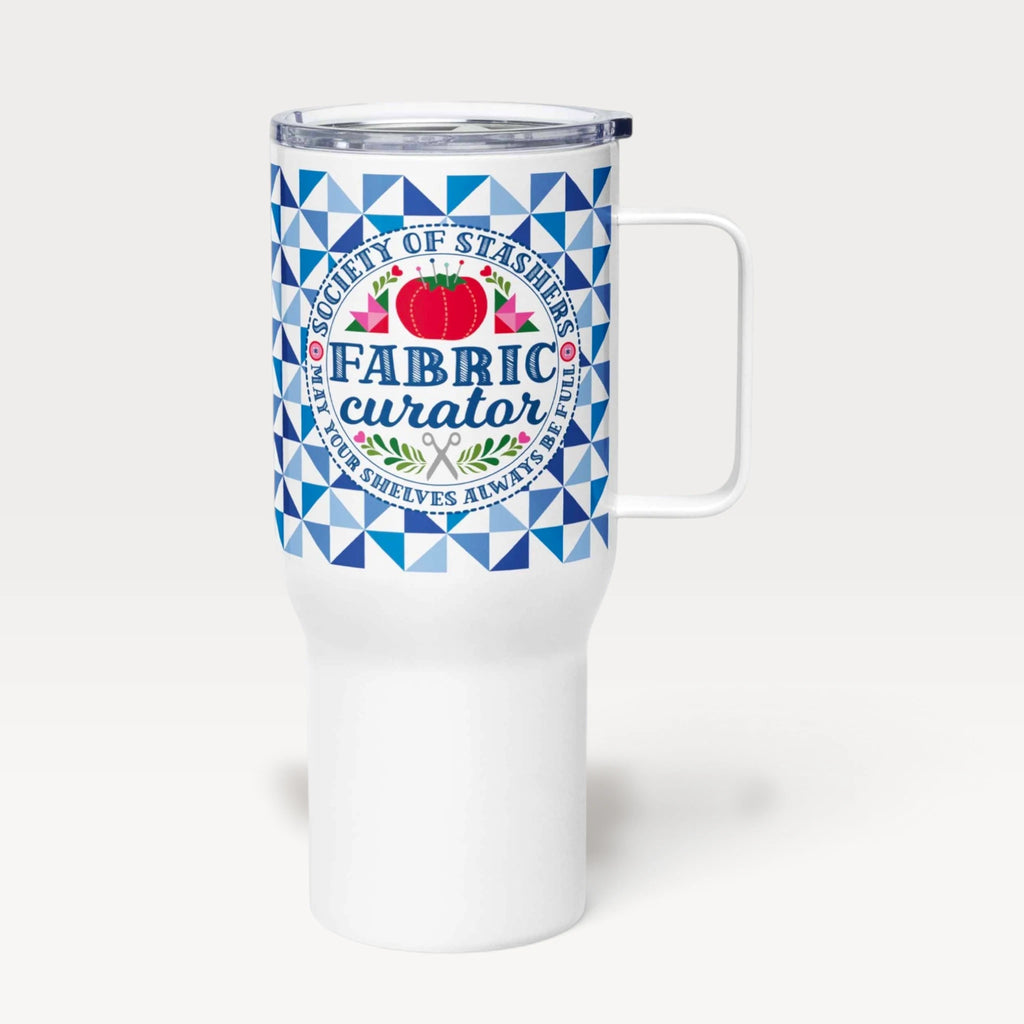 25 oz travel mug with handle and lid, Fabric Curator badge on a navy tile pattern – Kate Spain design for Pat Sloan