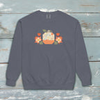 Falling for Fall patchwork pumpkin with quilt-block stars and hearts on a garment-dyed crewneck sweatshirt, styled on weathered wood – Kate Spain design for Pat Sloan