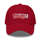“I’d rather be sewing” heart and sewing machine embroidered baseball cap in cardinal red, front view – Kate Spain design