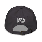 Law of the Paw® logo on the back of an embroidered baseball cap in grey, back view – Kate Spain design