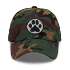 Law of the Paw® dog paw print embroidered baseball cap in camouflage, front view – Kate Spain design