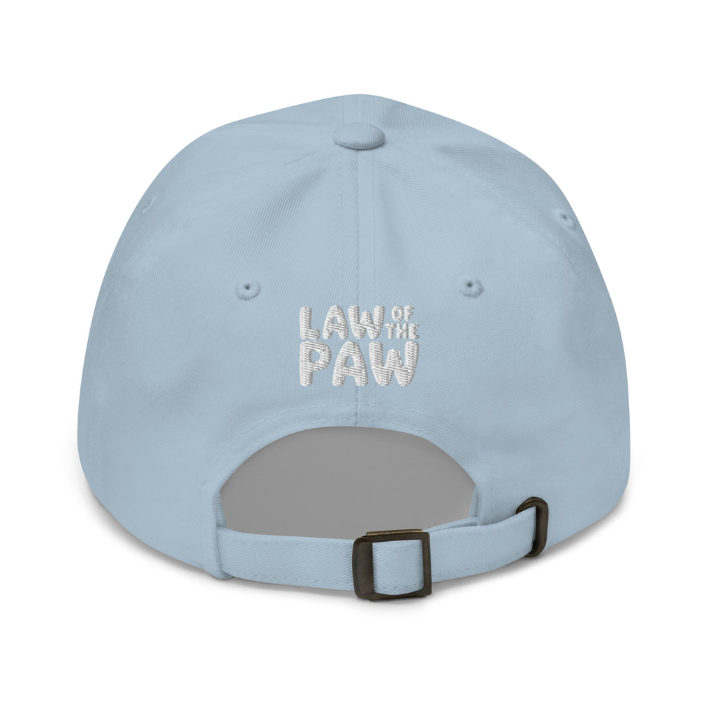 Law of the Paw® logo on the back of an embroidered baseball cap in light blue, back view – Kate Spain design